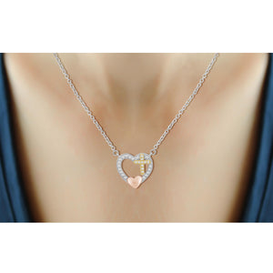 1/7 Carat T.W. White Diamond Three Tone Silver Cross In Heart Pendant